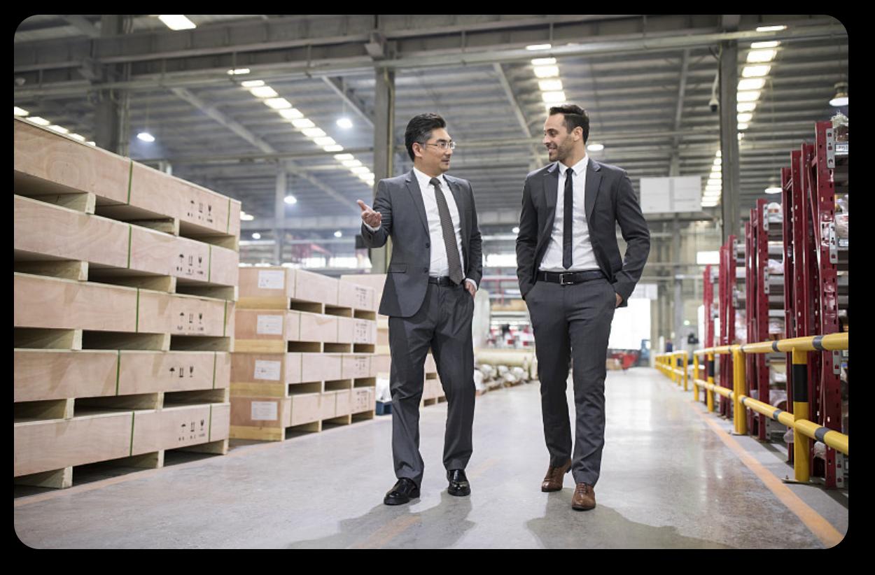 Linking Sourcing specialists reviewing production at a partner facility